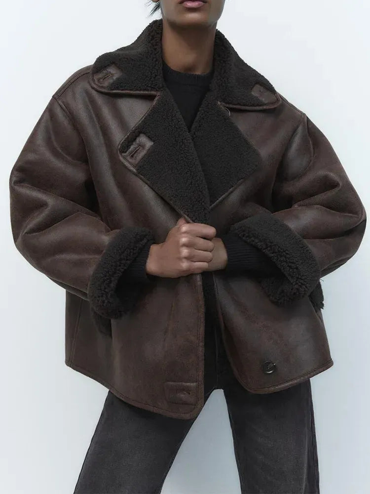 Women's brown oversized aviator jacket with wide dark collar and cuffs