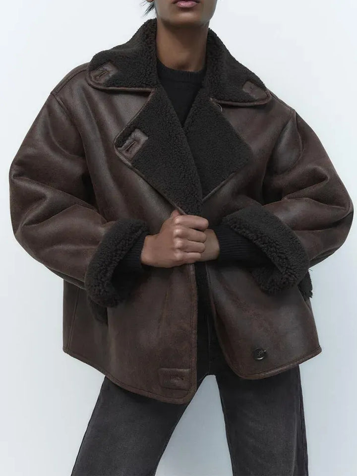 Women's brown oversized aviator jacket with wide dark collar and cuffs