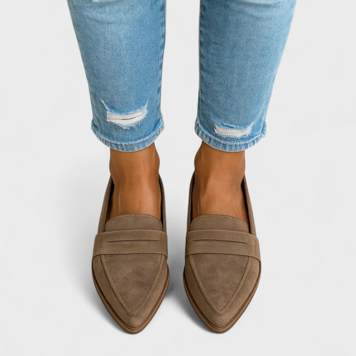 Women's pointed-toe penny loafers with low heels and front strap detail
