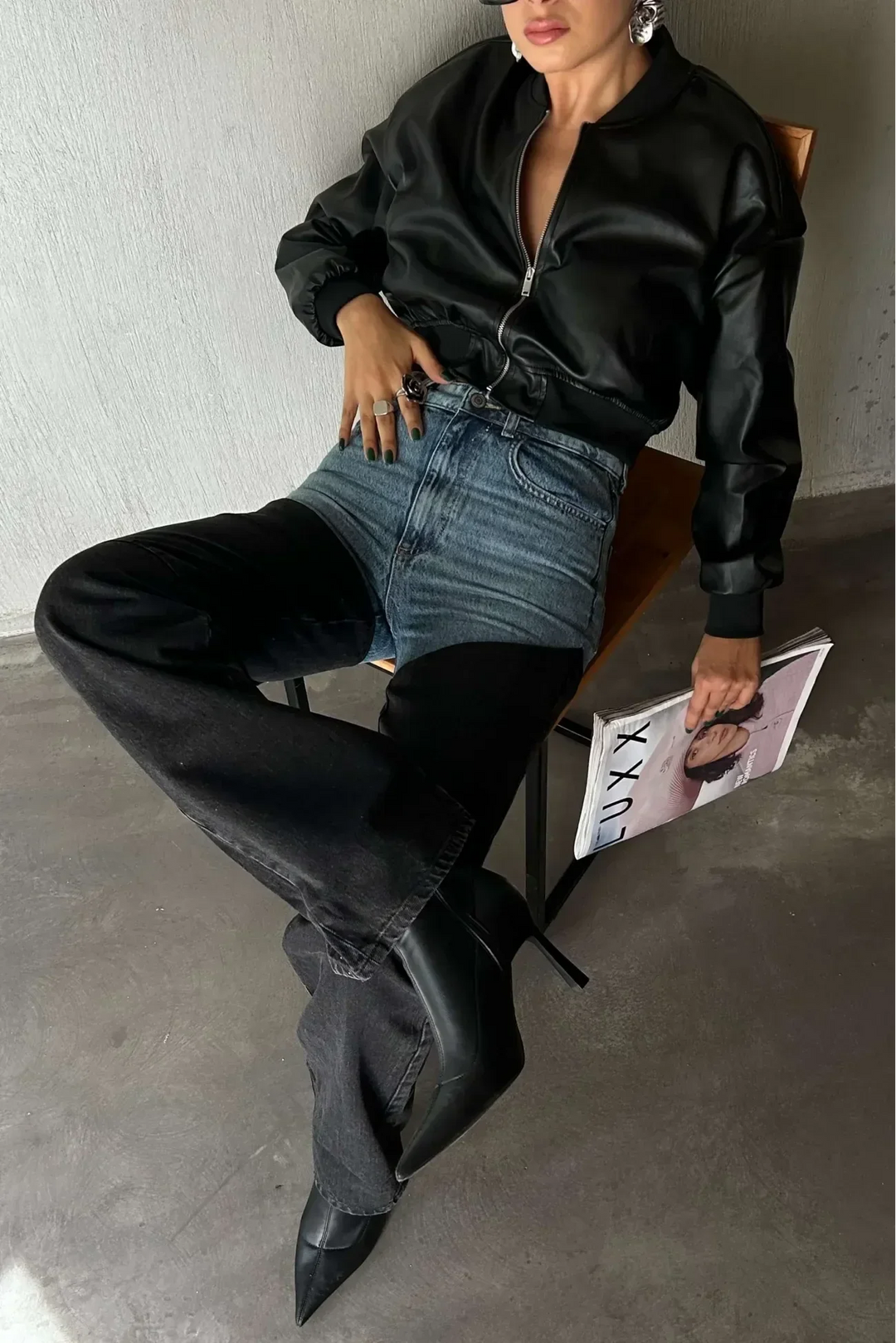 Women's high-waisted two-tone jeans with light blue upper panels and black straight legs