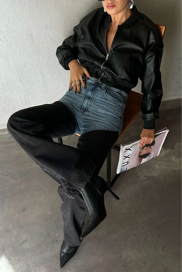 Women's high-waisted two-tone jeans with light blue upper panels and black straight legs