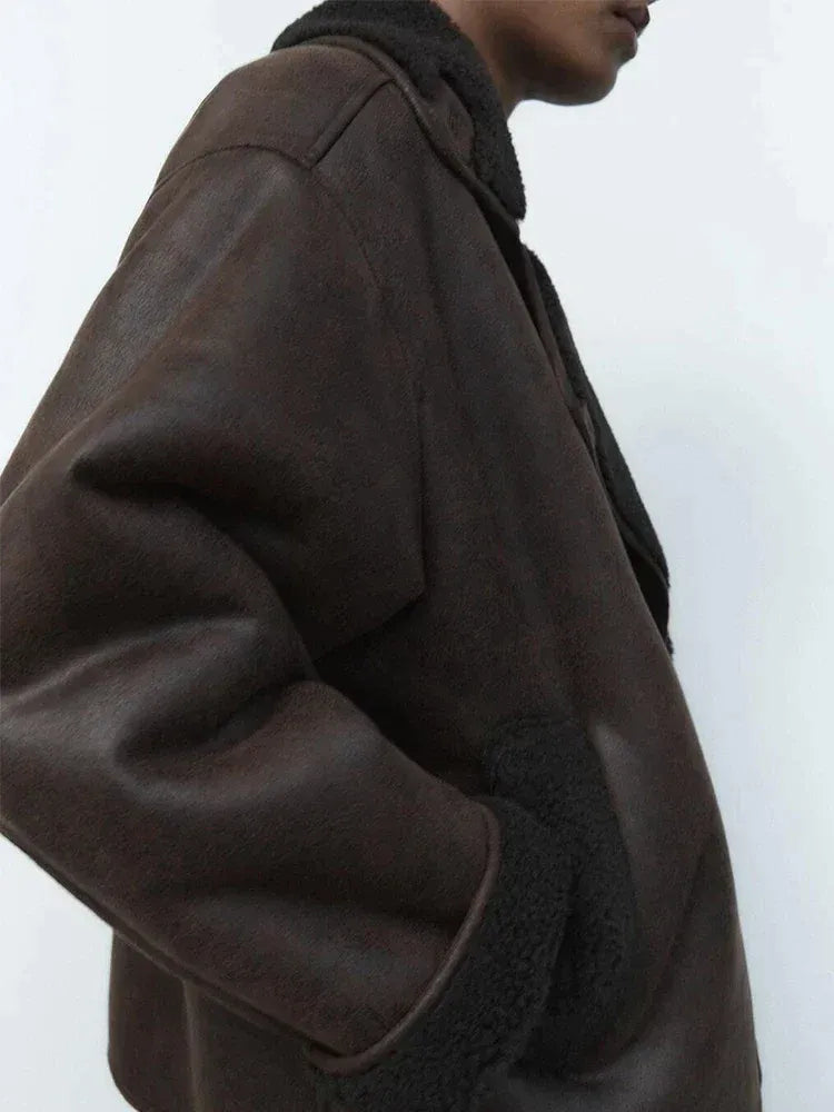 Women's brown oversized aviator jacket with wide dark collar and cuffs