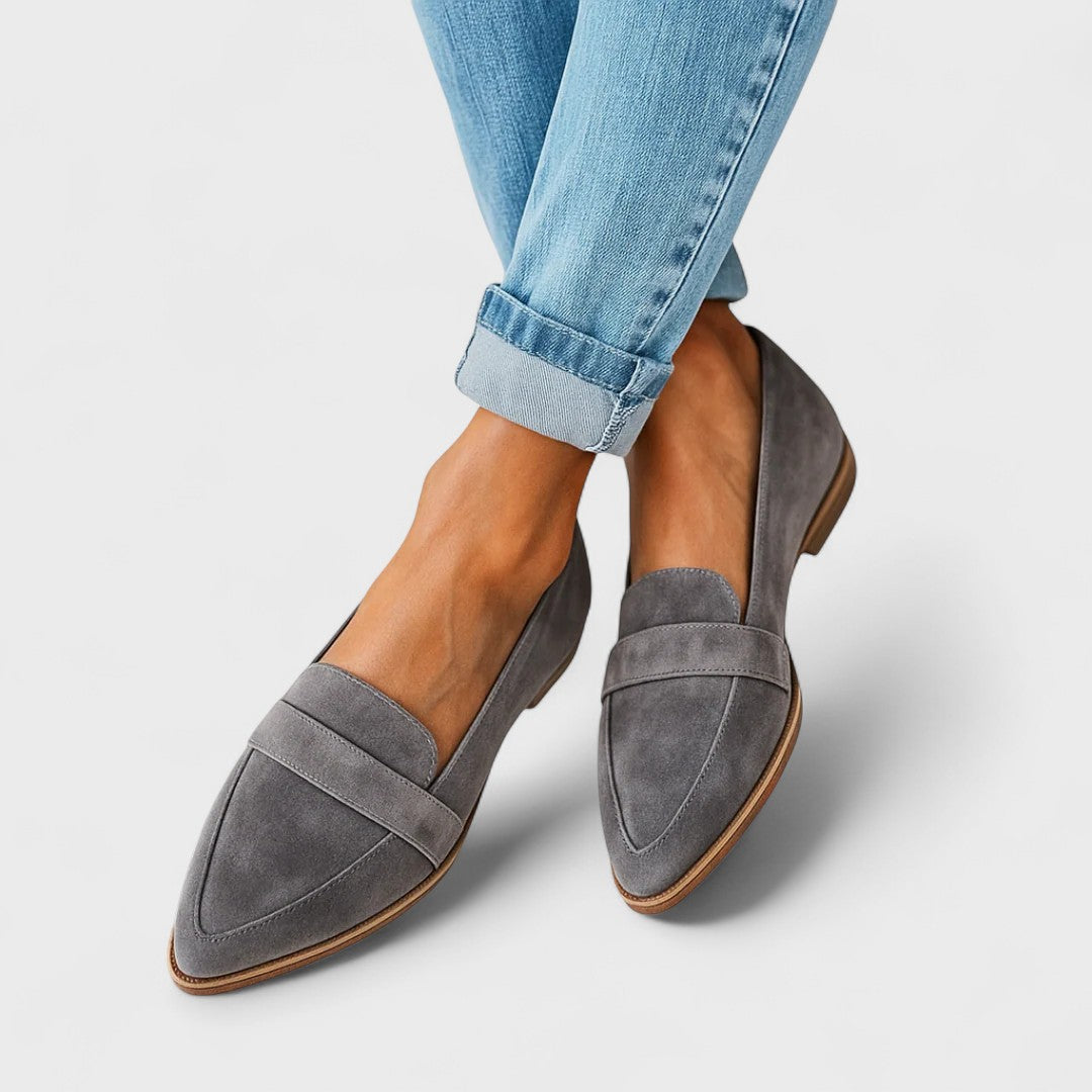 Women's pointed-toe penny loafers with low heels and front strap detail