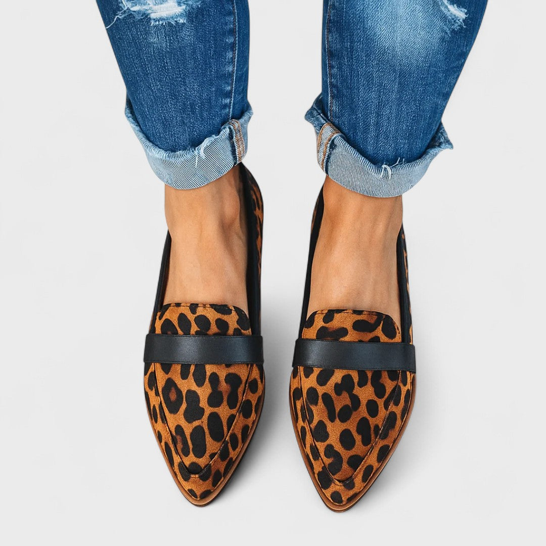 Women's pointed-toe penny loafers with low heels and front strap detail