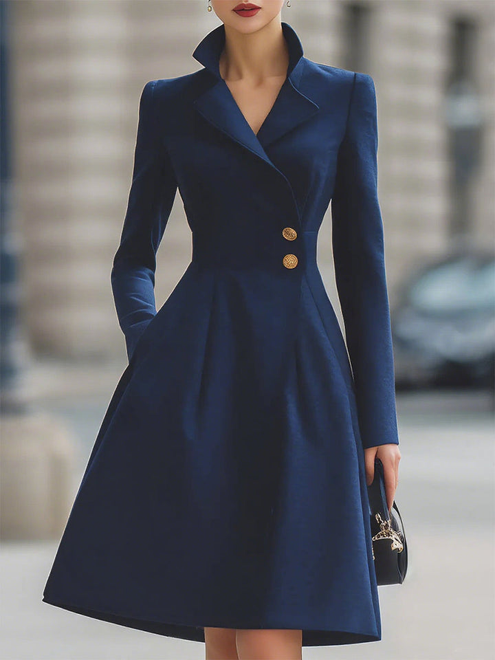 Women's navy tailored midi dress with peak lapel collar, long sleeves and flared skirt