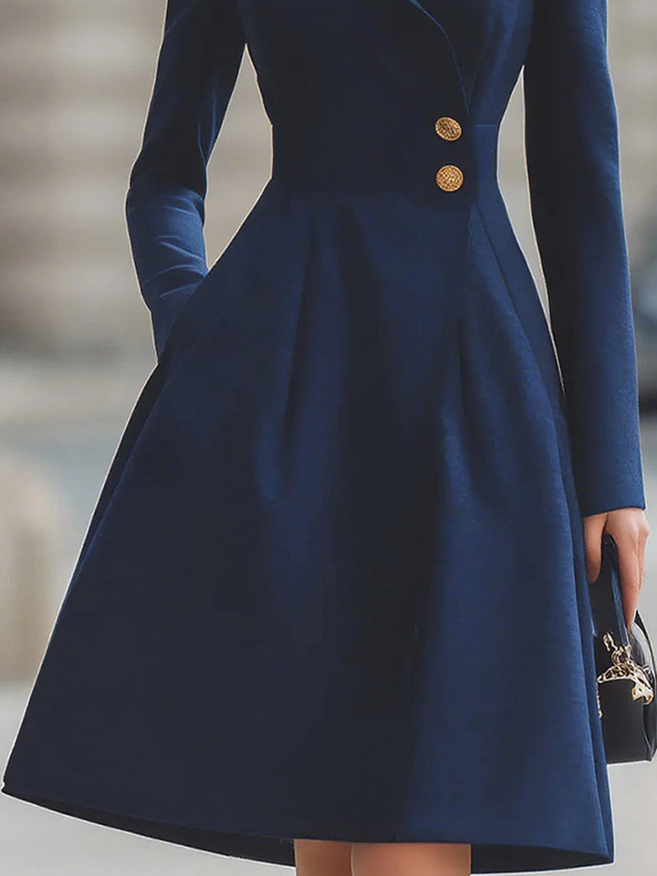 Women's navy tailored midi dress with peak lapel collar, long sleeves and flared skirt