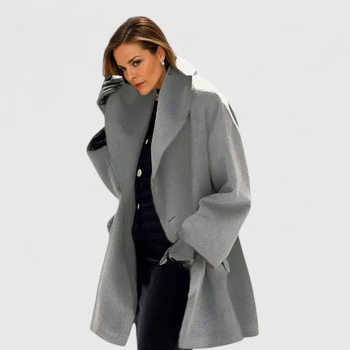 Women's oversized long coat with wide lapels, long sleeves and button front