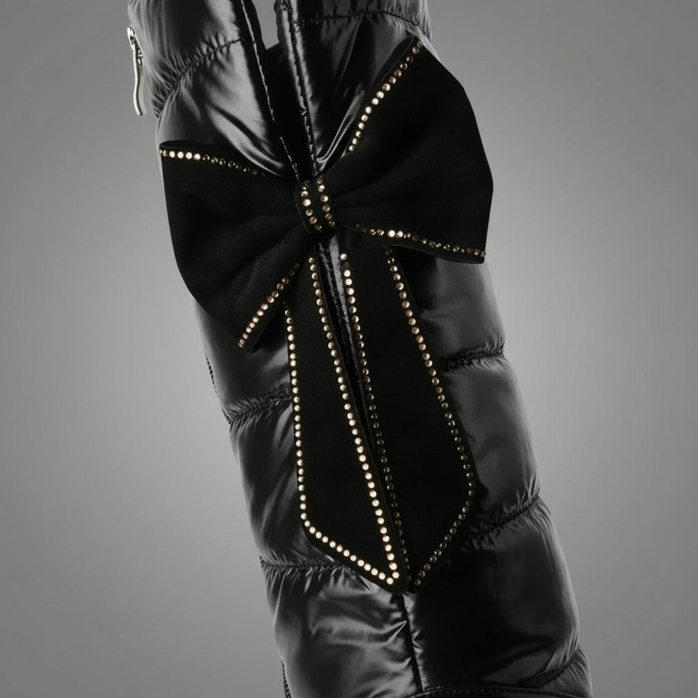 Women's black quilted over-the-knee boots with round toes, flat platform soles and bow detail