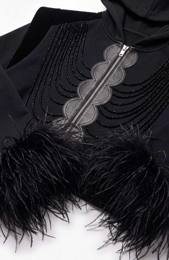 Black hooded zip hoodie with embellished front and feather-trimmed cuffs