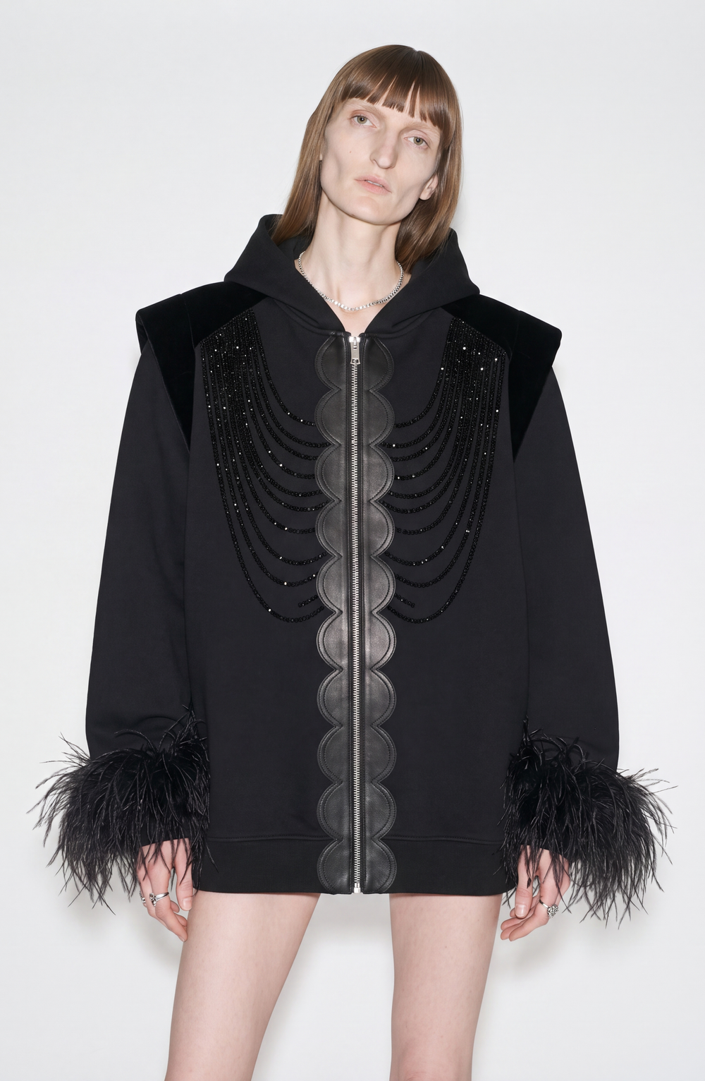 Black hooded zip hoodie with embellished front and feather-trimmed cuffs