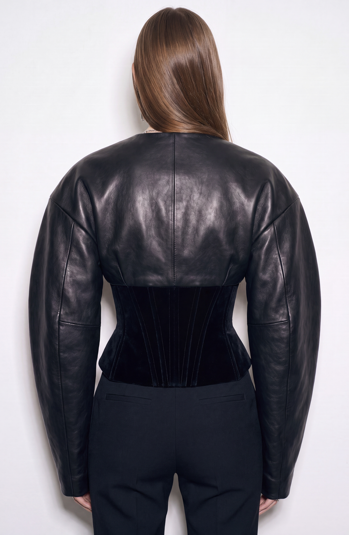 Black women's corset jacket with glossy upper panels, long sleeves and a front zipper