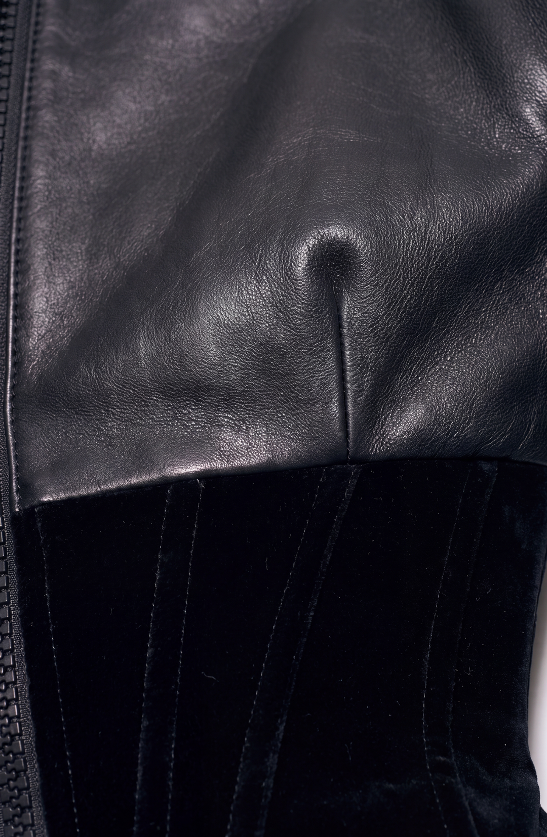 Black women's corset jacket with glossy upper panels, long sleeves and a front zipper