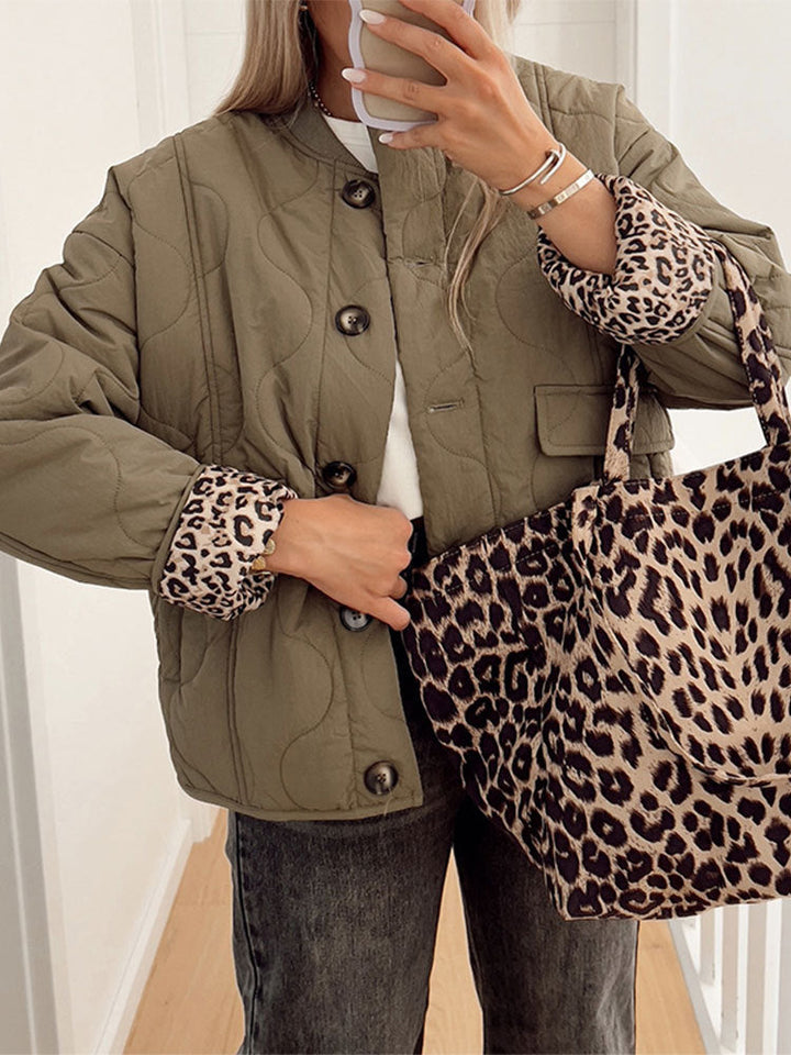 Women's quilted jacket with stand collar, button front and leopard-print cuffs