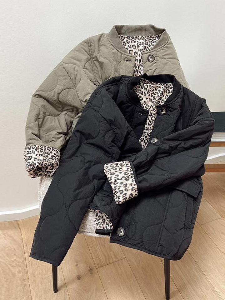 Women's quilted jacket with stand collar, button front and leopard-print cuffs