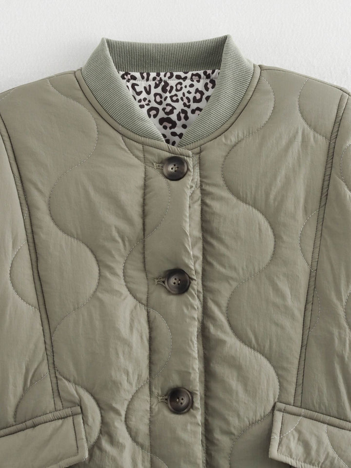 Women's quilted jacket with stand collar, button front and leopard-print cuffs