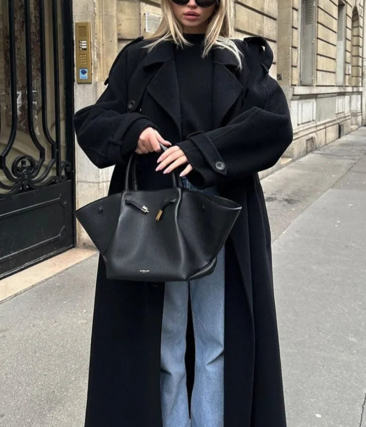 Women's black long double-breasted trench coat with lapels and waist belt