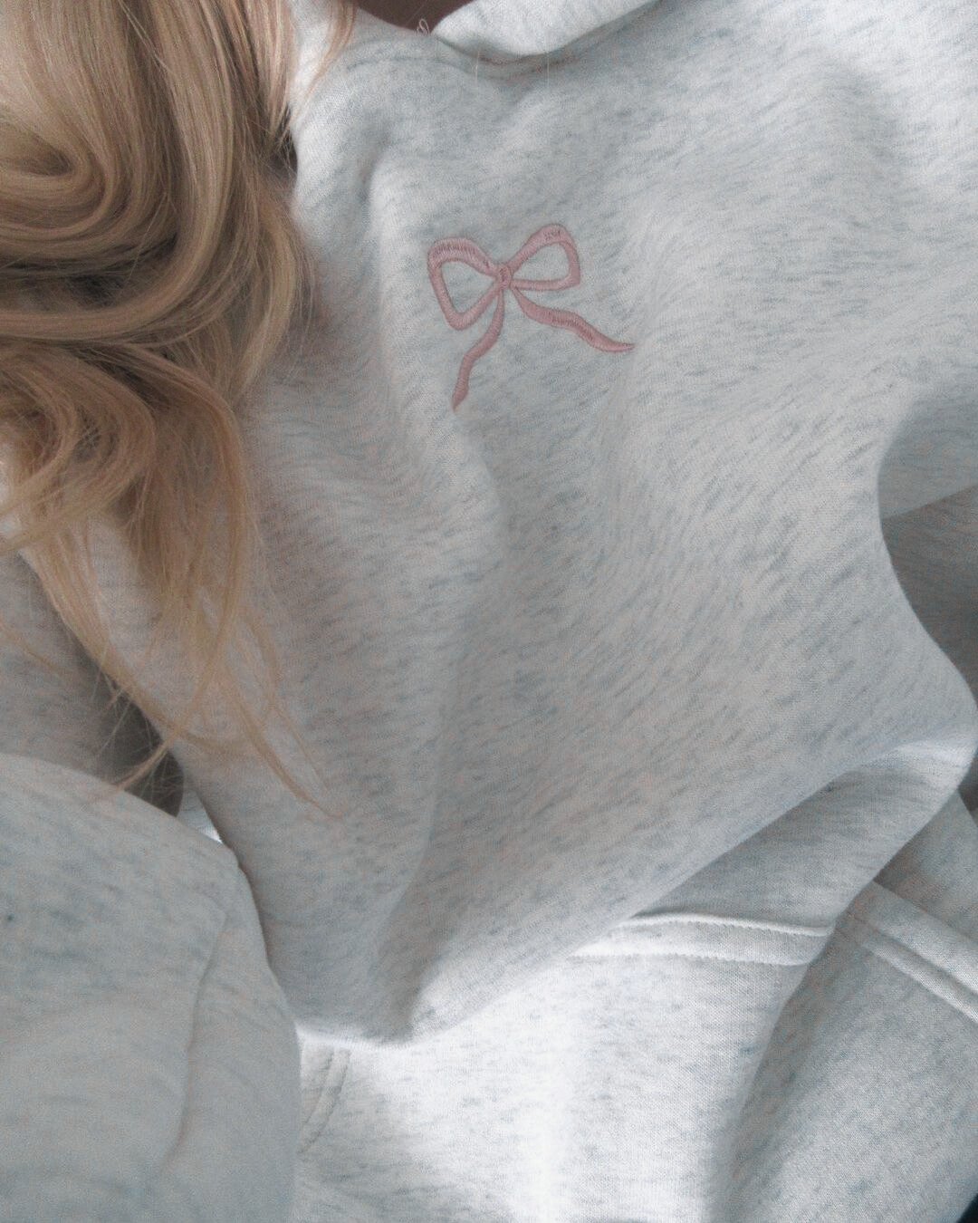 Light grey women's hoodie with floral lined hood and pink embroidery