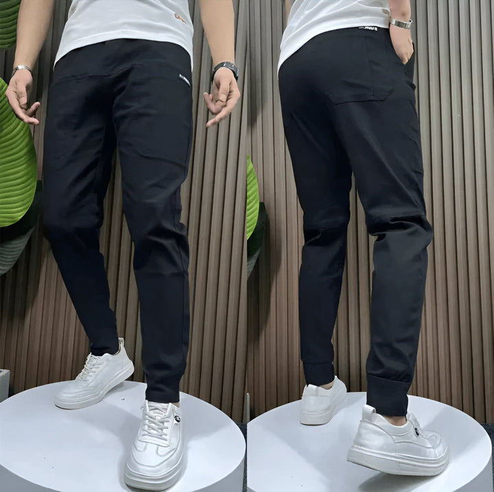 Unisex tapered cargo trousers with side pockets and ankle cuffs