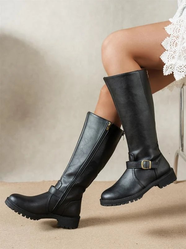 Women's knee-high boots with side zippers, buckle straps and lug soles