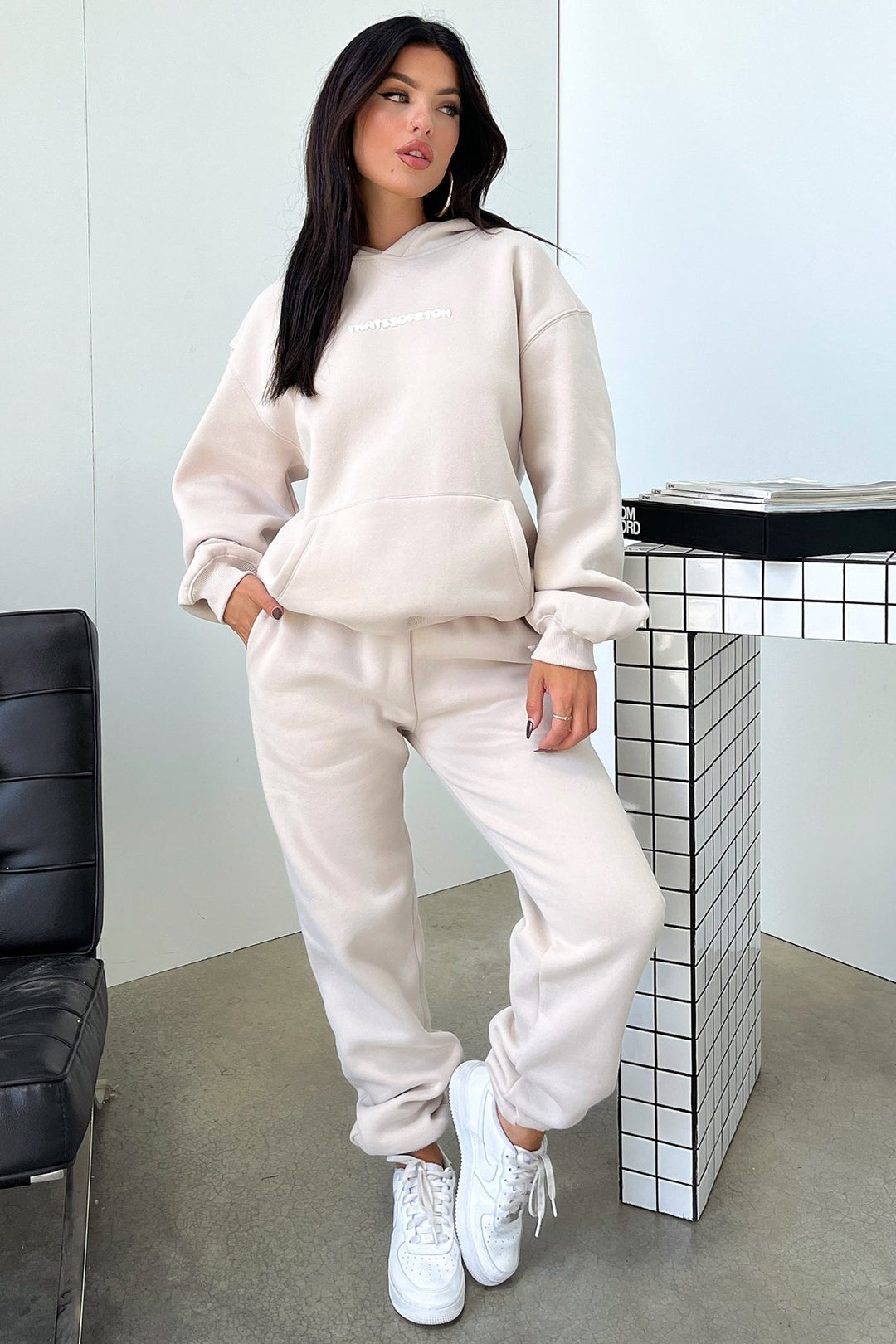 Women's beige cropped hoodie with hood, long sleeves, ribbed trims and chest lettering