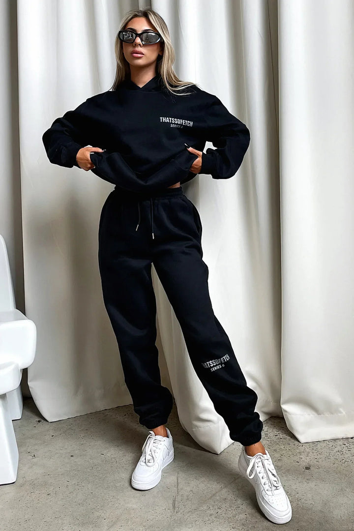 Women's black hooded sweatshirt with white chest graphic text