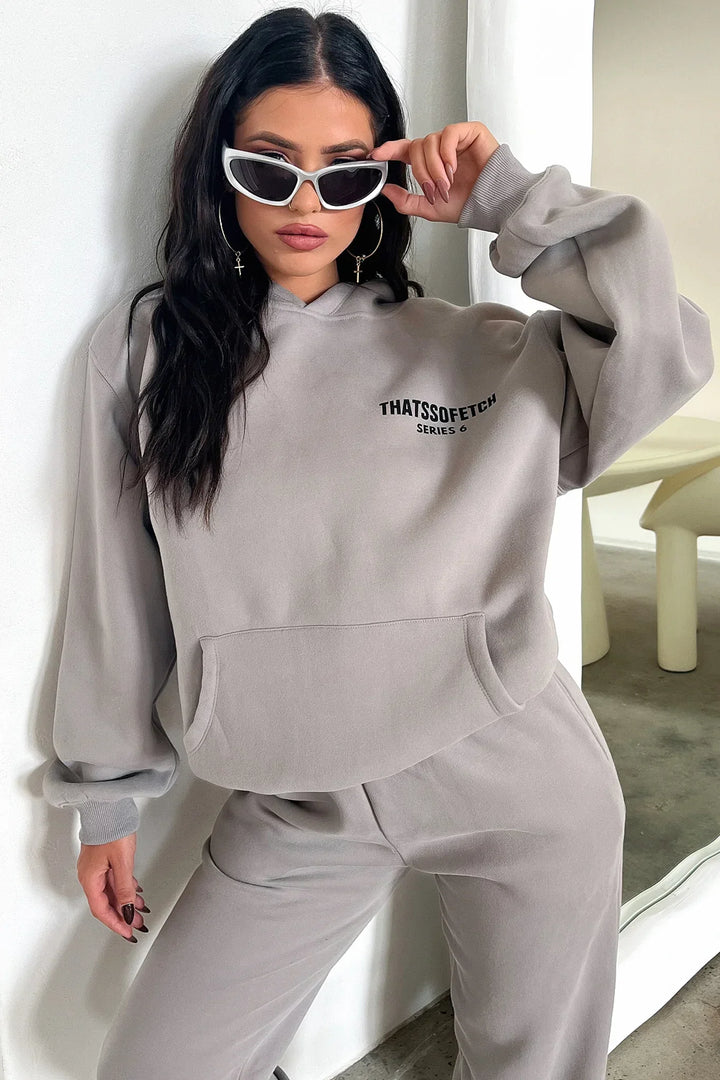 Women's grey hooded sweatshirt with long sleeves, front logo and ribbed trims