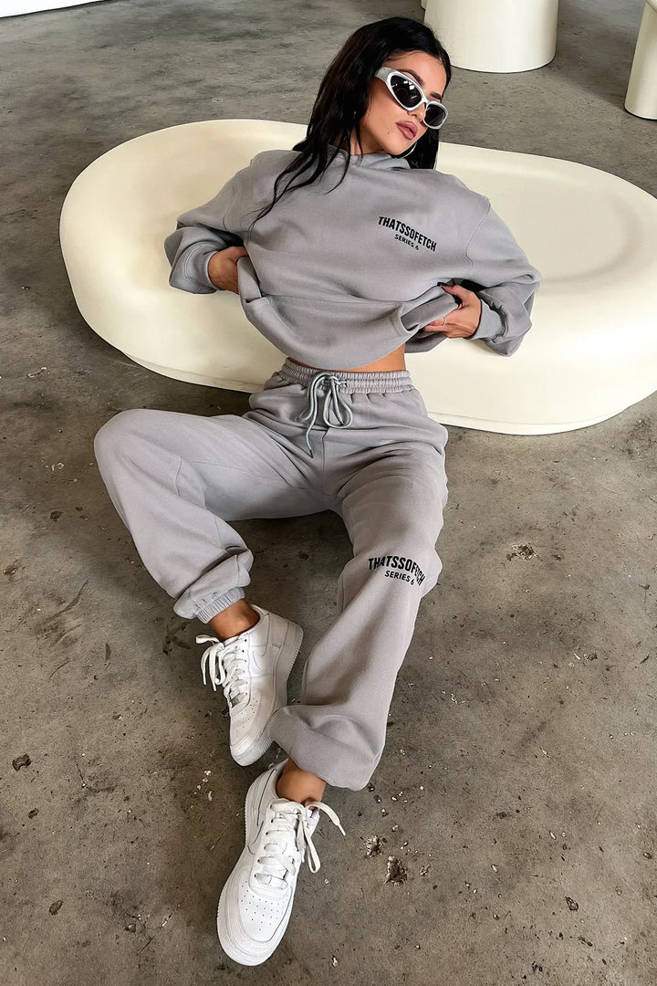 Women's grey hooded sweatshirt with long sleeves, front logo and ribbed trims