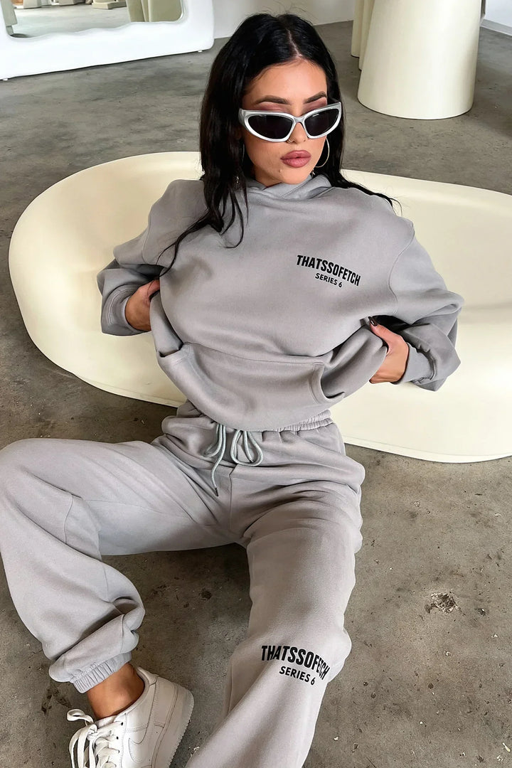 Women's grey hooded sweatshirt with long sleeves, front logo and ribbed trims