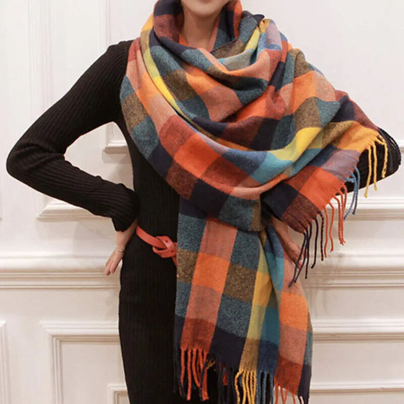 Women's checked fringe scarf worn as a draped shoulder wrap