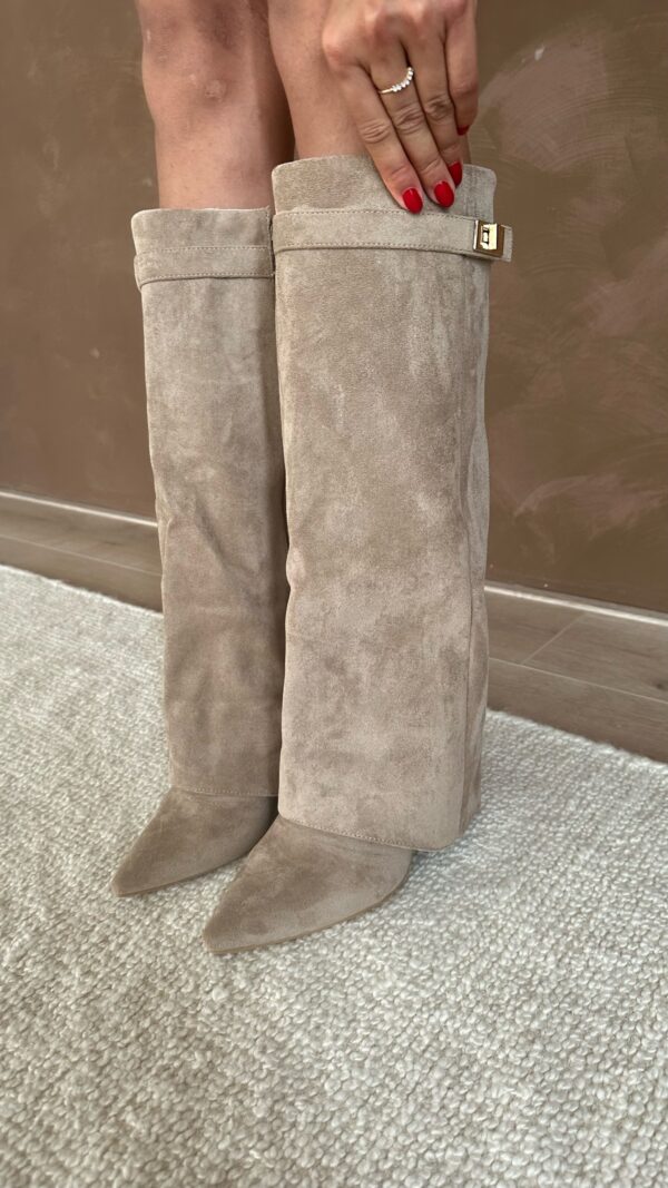 Women's tall pointed-toe boots with buckle strap detail