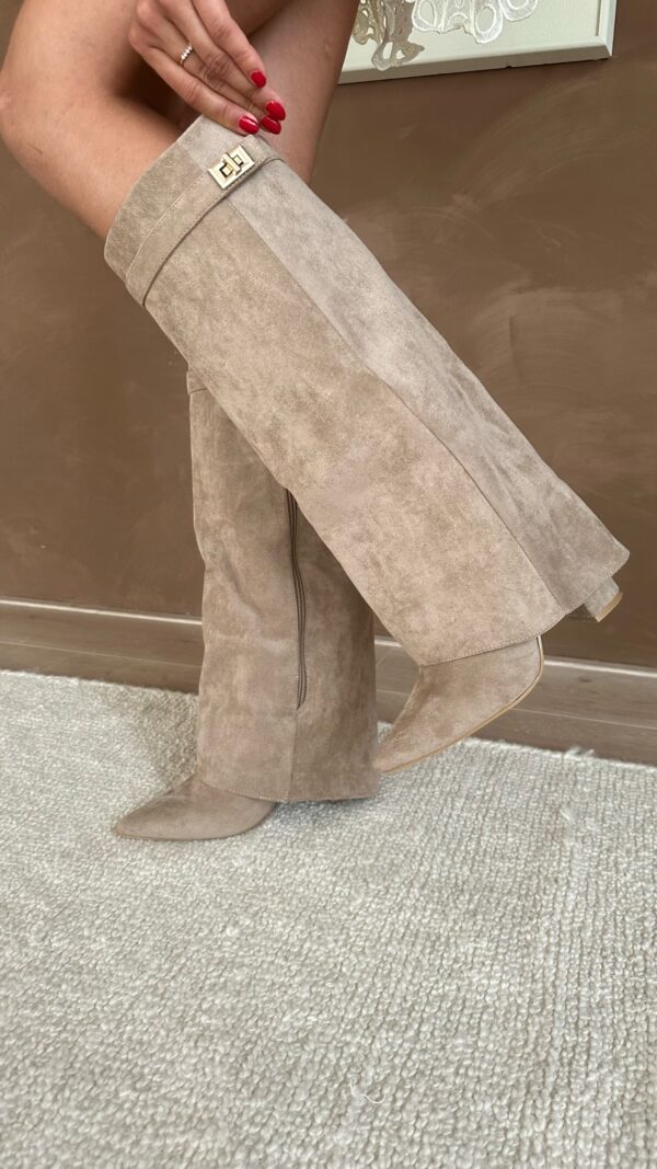 Women's tall pointed-toe boots with buckle strap detail