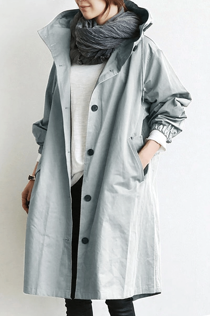 Women's long hooded button-front raincoat with side pockets