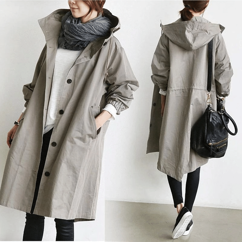 Women's long hooded button-front raincoat with side pockets