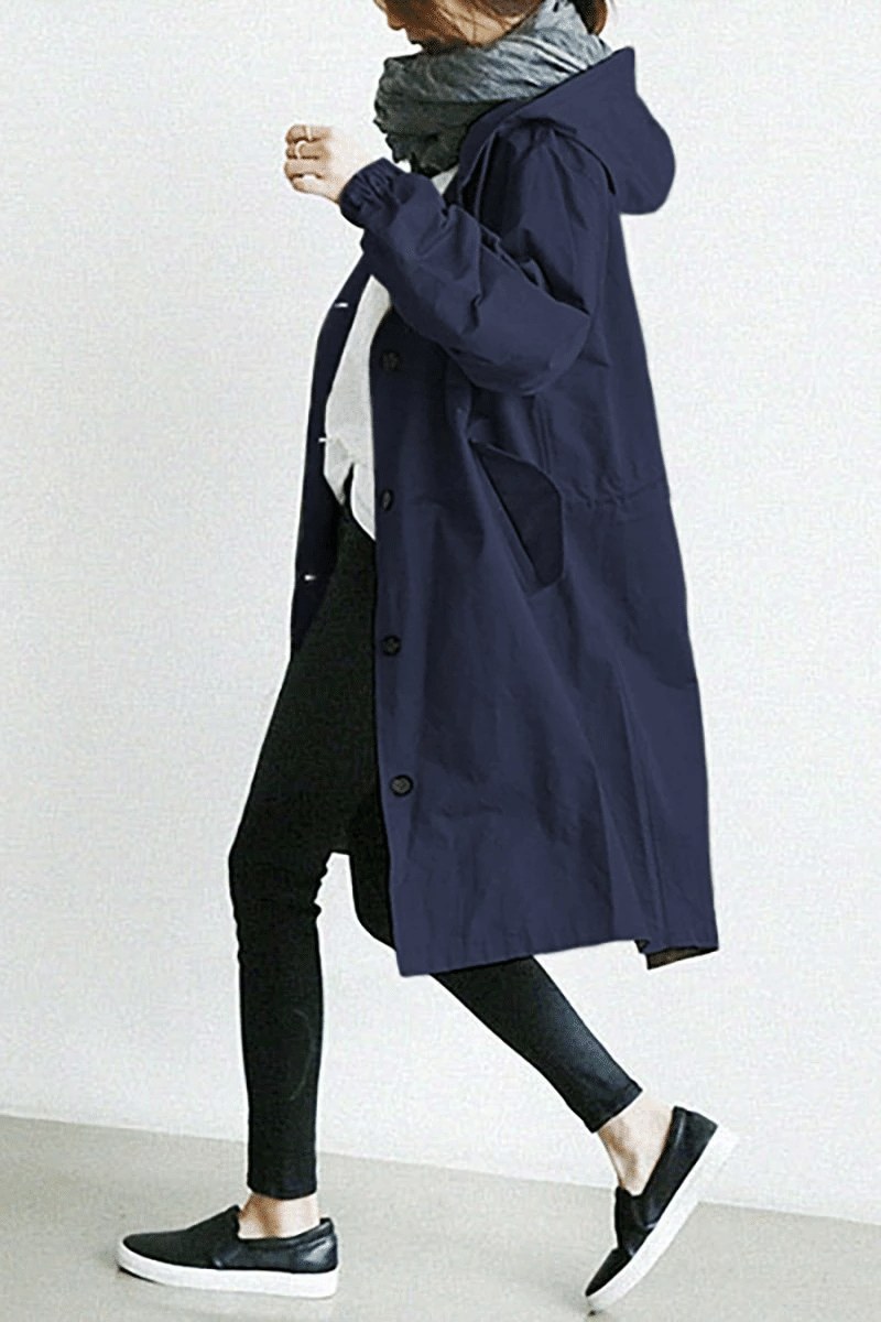 Women's long hooded button-front raincoat with side pockets