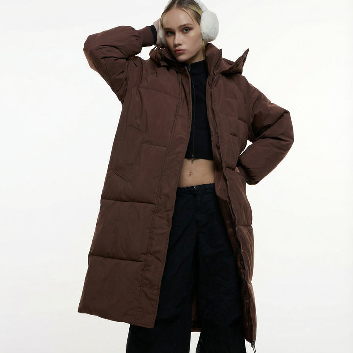 Women's long quilted puffer coat with hood, zipper front and patch pockets