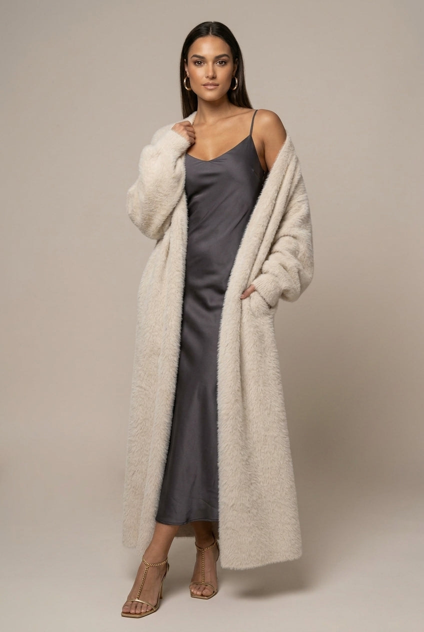 Women's long faux fur cardigan with open front and full-length silhouette