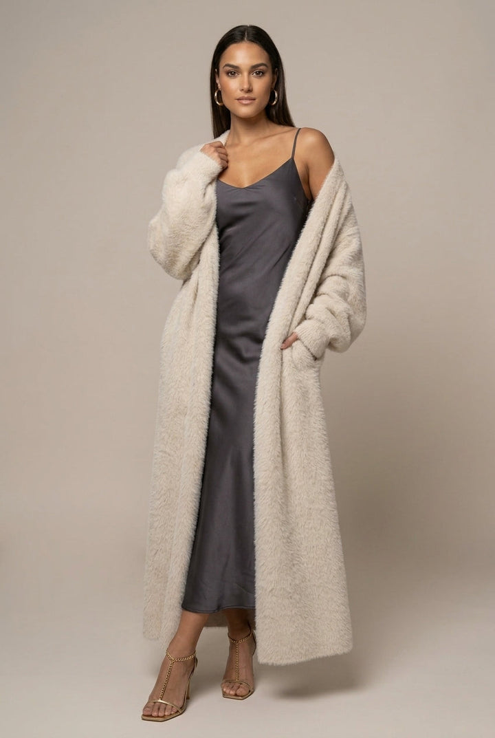 Women's long faux fur cardigan with open front and full-length silhouette