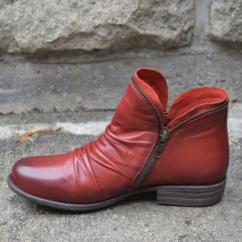 Ruched ankle boot with diagonal side zip, round toe and low heel