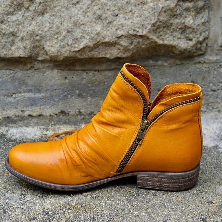 Ruched ankle boot with diagonal side zip, round toe and low heel