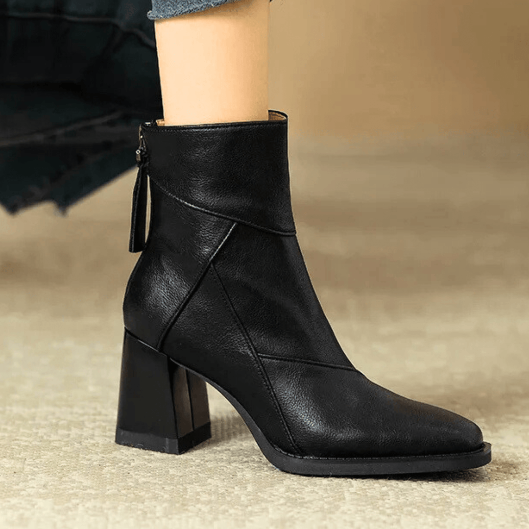 Women's pointed toe ankle boots with a high block heel and side tassel detail