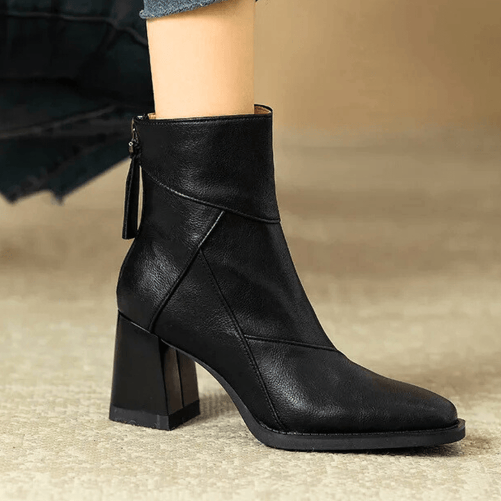Women's pointed toe ankle boots with a high block heel and side tassel detail