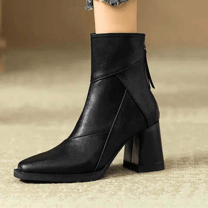 Women's pointed toe ankle boots with a high block heel and side tassel detail