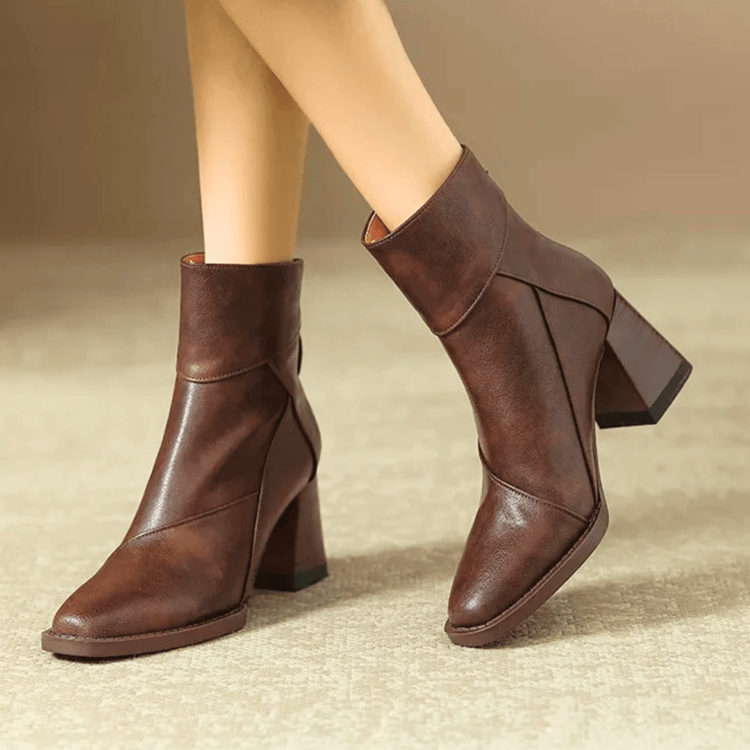Women's pointed toe ankle boots with a high block heel and side tassel detail
