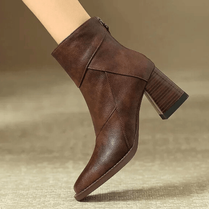 Women's pointed toe ankle boots with a high block heel and side tassel detail