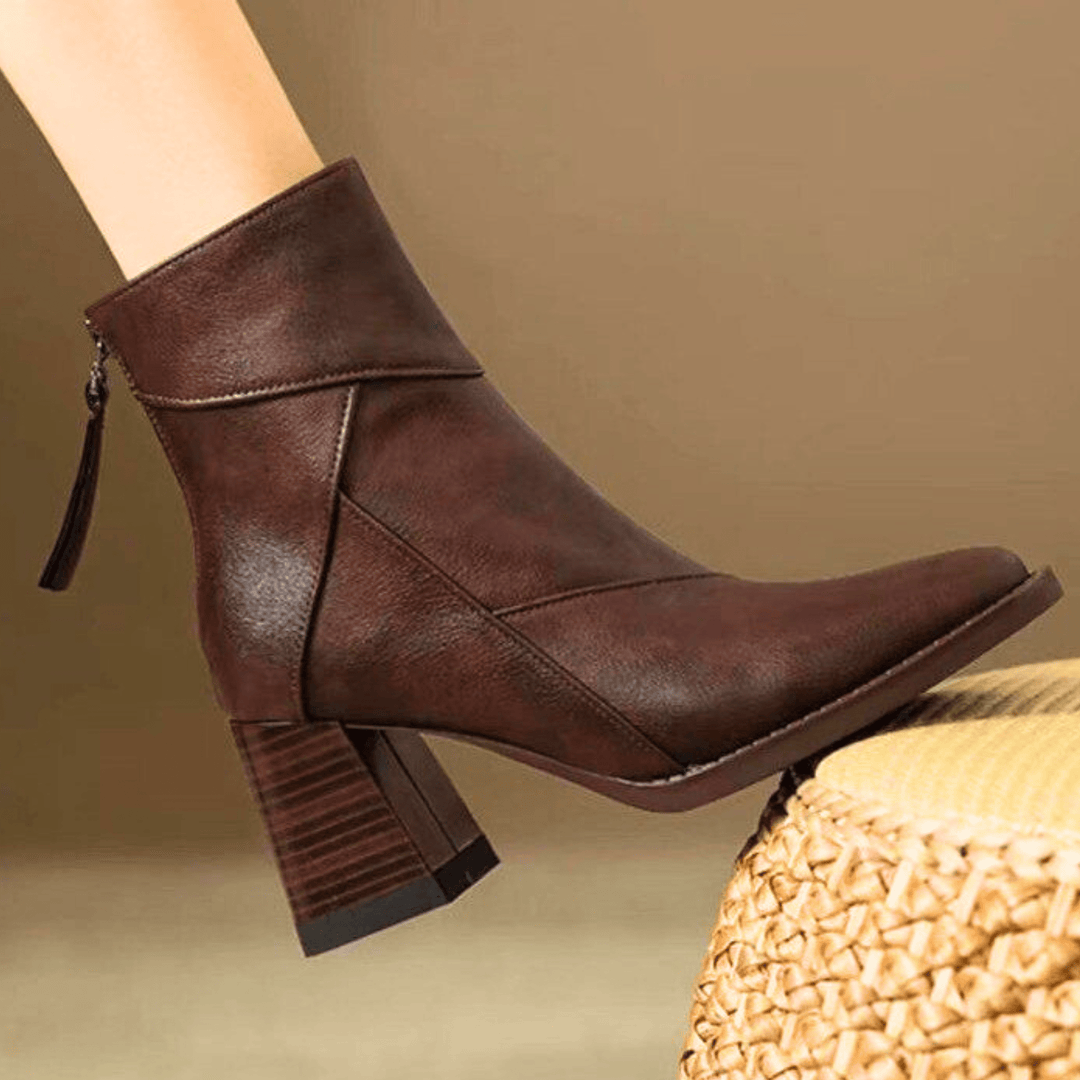 Women's pointed toe ankle boots with a high block heel and side tassel detail