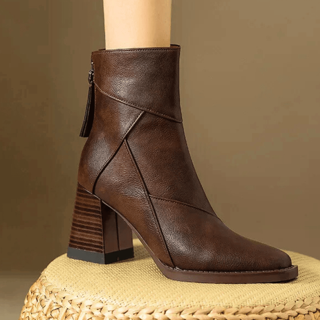 Women's pointed toe ankle boots with a high block heel and side tassel detail