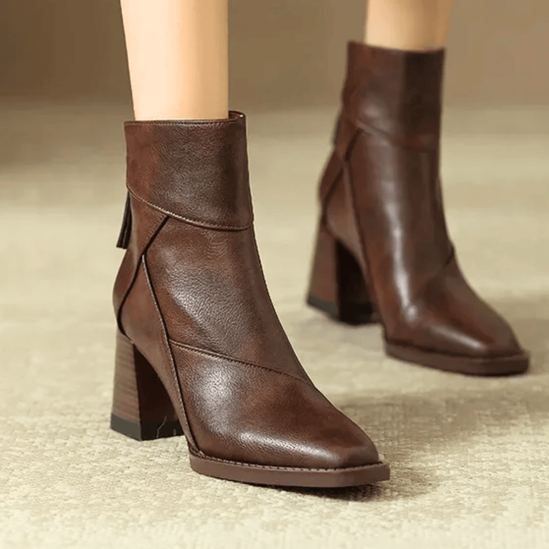 Women's pointed toe ankle boots with a high block heel and side tassel detail