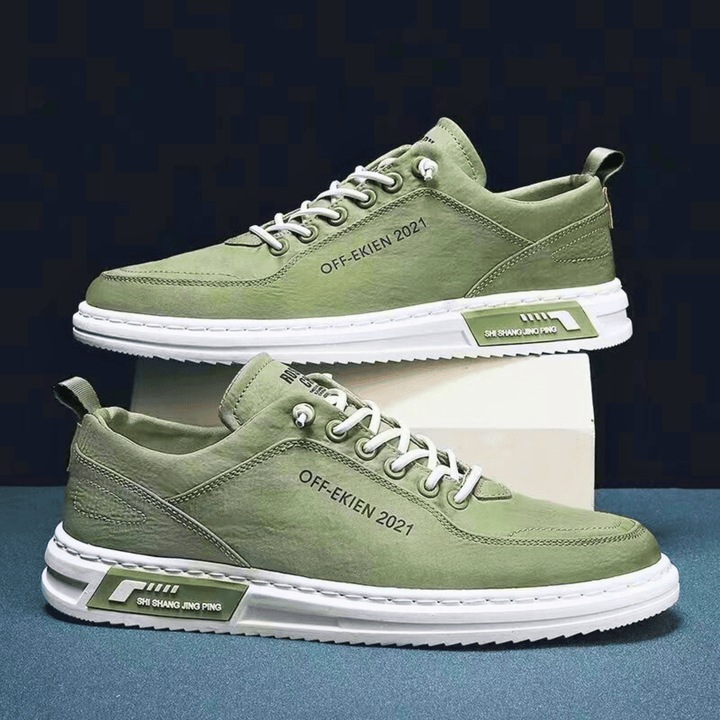 Low-top lace-up sneakers with stitched panels, contrast sole and rear pull tab