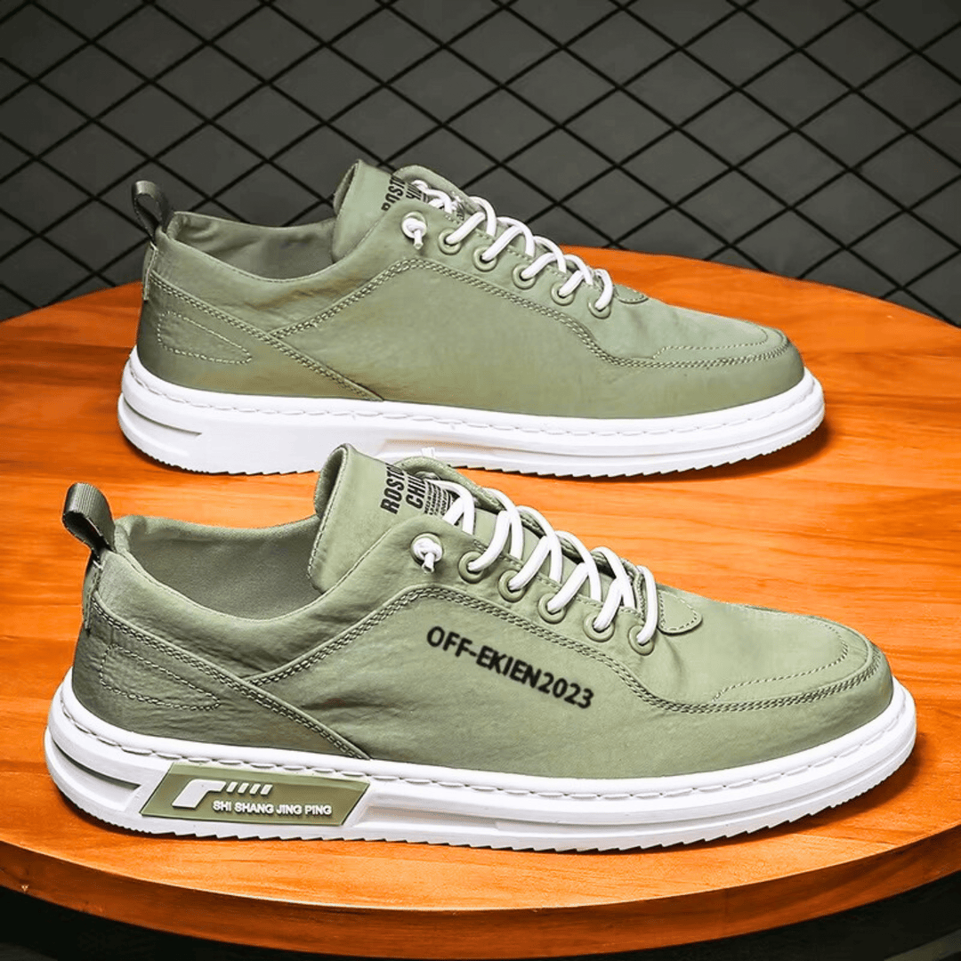 Low-top lace-up sneakers with stitched panels, contrast sole and rear pull tab
