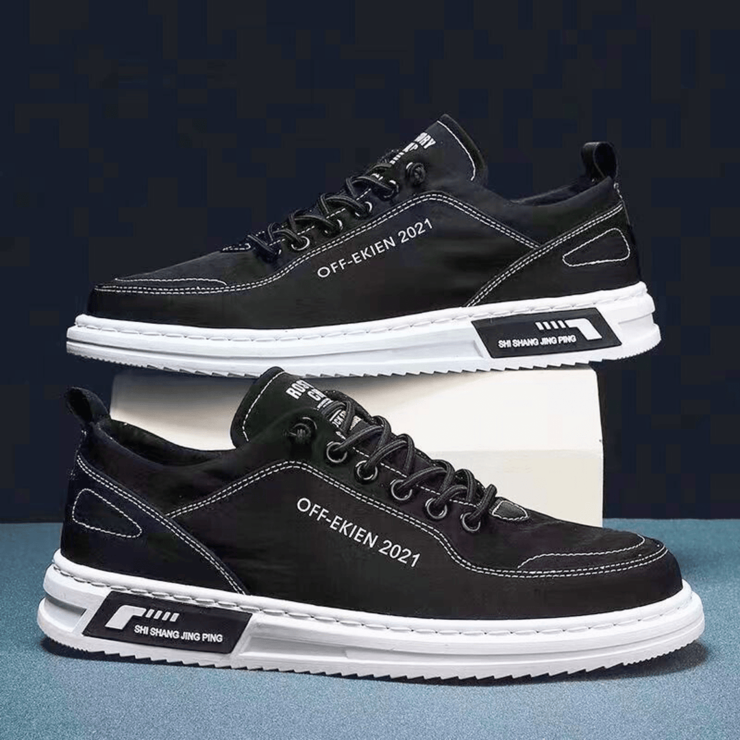 Low-top lace-up sneakers with stitched panels, contrast sole and rear pull tab